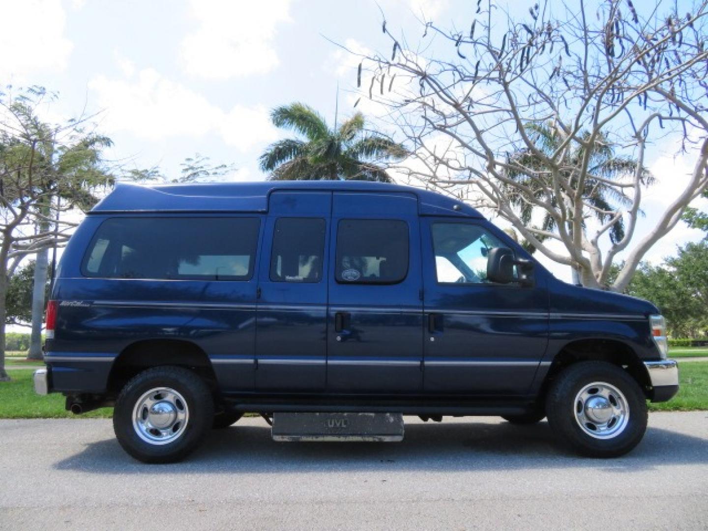 2011 Dark Blue /Gray Ford E-Series Wagon E-350 XLT Super Duty (1FBNE3BS4BD) with an 6.8L V10 SOHC 20V engine, located at 4301 Oak Circle #19, Boca Raton, FL, 33431, (954) 561-2499, 26.388861, -80.084038 - You are looking at a Gorgeous 2011 Ford Econoline E350 XLT Norcal Max High Top Handicap Wheelchair Conversion Van with 6.8L V10, 15K Original Miles, 9 Inch Lowered Floor, Braun UVL Side Entry Wheelchair Lift, Remote Control Power Side Entry Doors, Expanded Side Entry Doors, Q Straint Tie Down, Syste - Photo#5